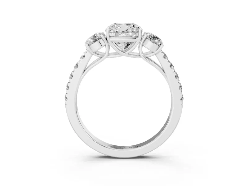 Cushion Cut Diamond Three-Stone Ring Set in White gold with Round Side Stones and Delicate Pavé Band