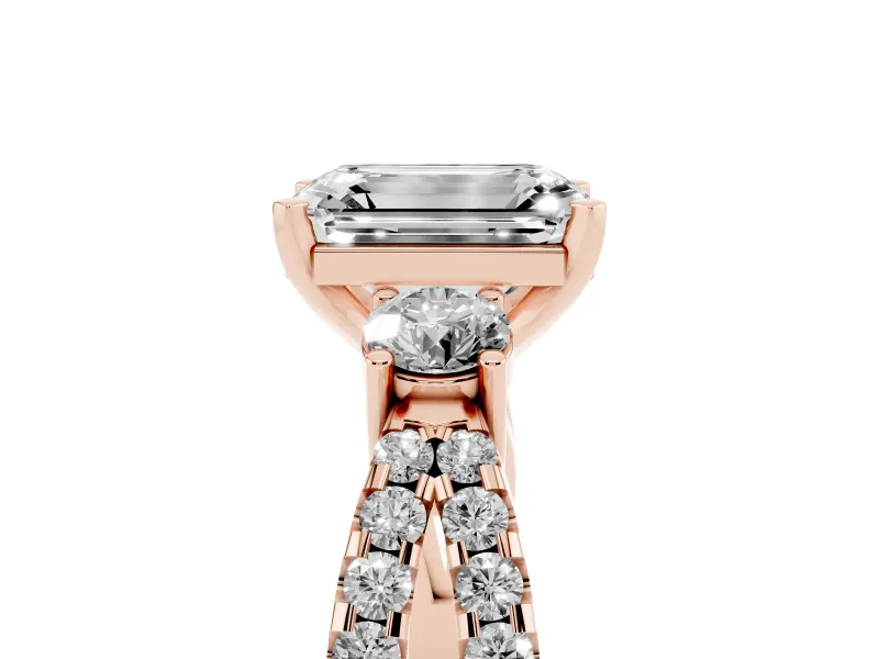 Emerald Cut Diamond Three-Stone Ring Set in Rose gold with Pavé Split Shank and Prong Setting