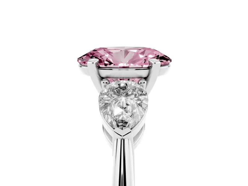 Fancy Pink Three-Stone Oval Cut Diamond Ring Set in Platinum with Pear Side Stones and Prong Setting