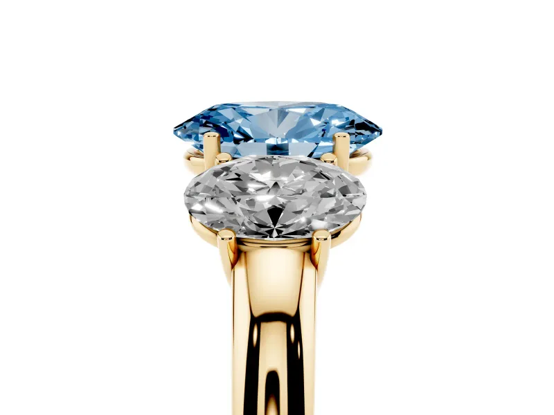 Fancy Blue Oval Cut Diamond Three-Stone Ring Set in Yellow gold with Bold Center and Classic Band