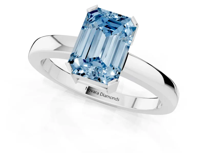 Fancy Blue Emerald Cut Diamond Solitaire Ring Set in White gold with Prong Head and Smooth Polished Band
