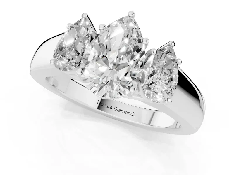 Three-Stone Pear Cut Diamond Ring Set in White gold with Matching Prong Settings and Plain Band