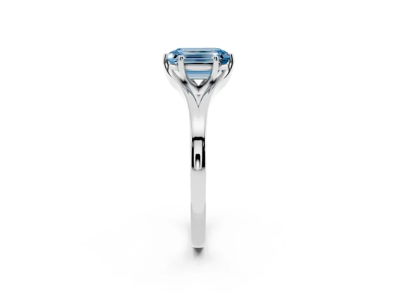 Fancy Blue Emerald Cut Diamond Solitaire Ring Set in White gold with Polished Tapered Band and Prong Setting