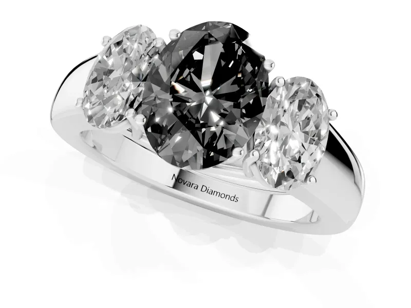 Fancy Black Three-Stone Oval Cut Diamond Ring Set in Silver with Matching Prong Settings and Plain Band