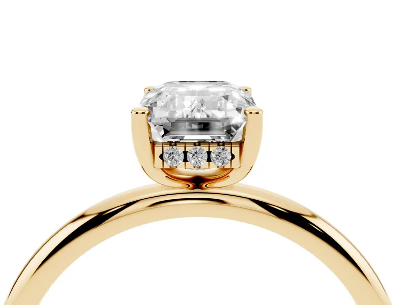 Emerald Cut Diamond Solitaire Engagement Ring Set in Yellow gold with Prong Setting and Polished Band