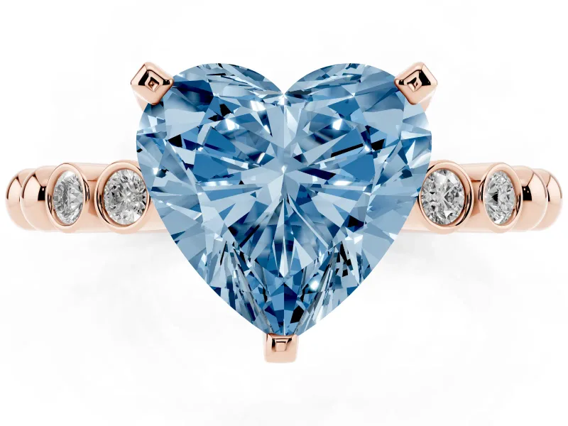 Fancy Blue Heart Cut Diamond Solitaire Engagement Ring Set in Rose gold with Bezel Accents on Beaded Band