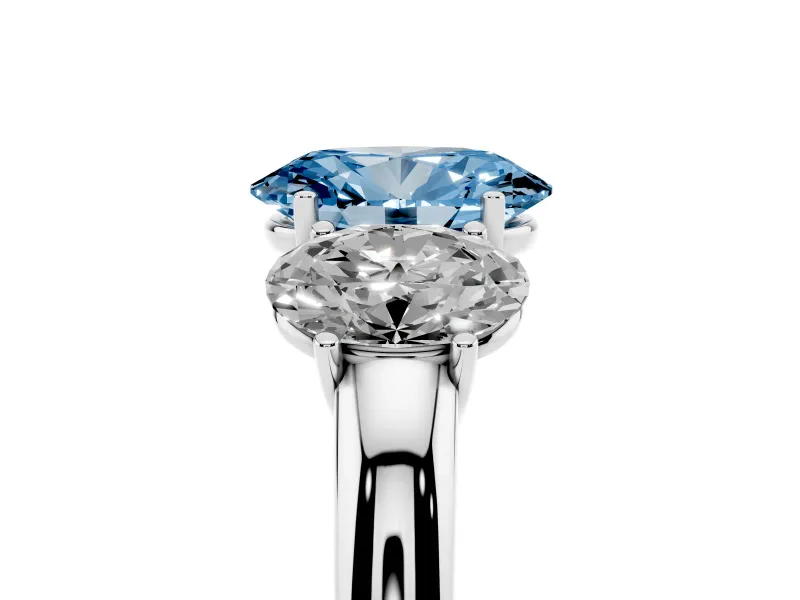 Fancy Blue Oval Cut Diamond Three-Stone Ring Set in White gold with Bold Center and Classic Band
