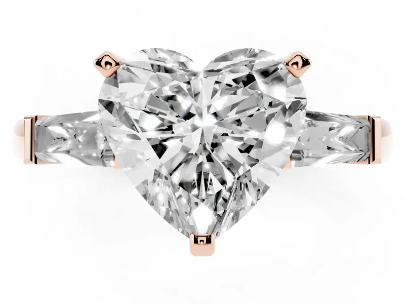 Heart Cut Diamond Solitaire Ring Set in Rose gold with Tapered Baguette Side Stones and Prong Setting