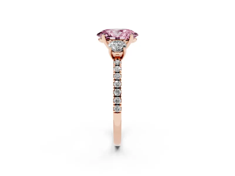 Fancy Pink Oval Cut Diamond Three-Stone Ring Set in Rose gold with Pavé Band and Graduated Sides