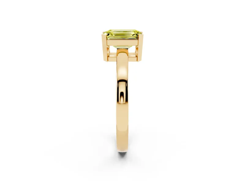 Fancy Yellow Emerald Cut Diamond Solitaire Ring Set in Yellow gold with Prong Head and Smooth Polished Band
