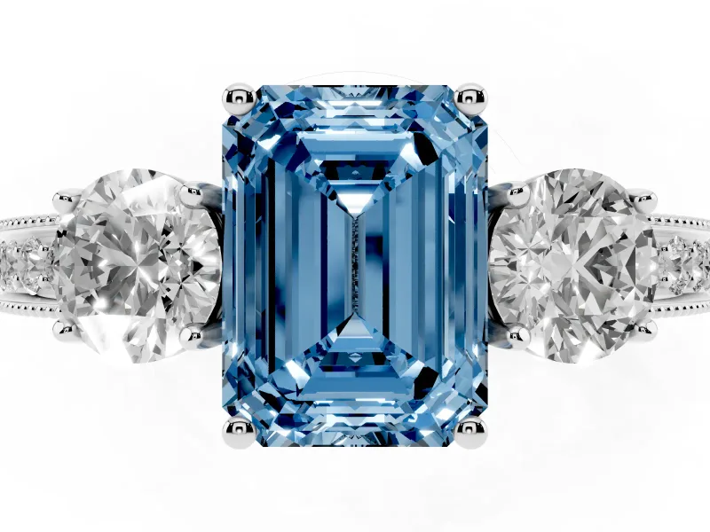 Emerald Cut Three Stone Engagement Ring Setting for a Fancy Blue Lab-Grown Diamond | Graduated Pave Band | Platinum