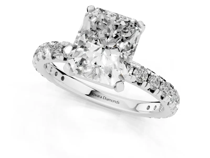 Radiant Cut Diamond Pavé Solitaire Ring Set in White gold with Round Band and Prong Setting