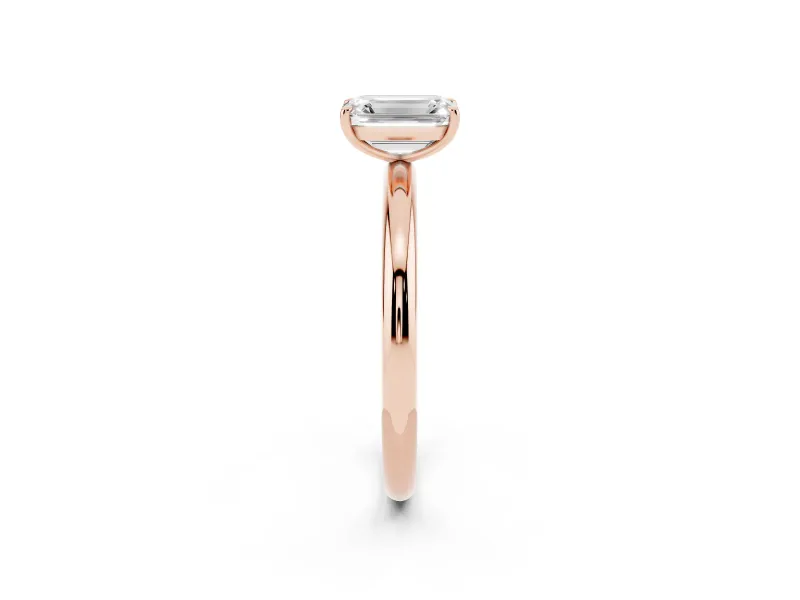 Emerald Cut Diamond Solitaire Ring Set in Rose gold with Prong Setting on a Polished Plain Band