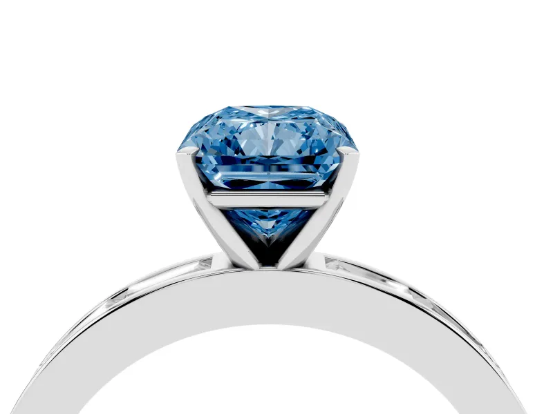 Fancy Blue Radiant Cut Diamond Solitaire Ring Set in Silver with Channel-Set Baguette Band and Prong Setting
