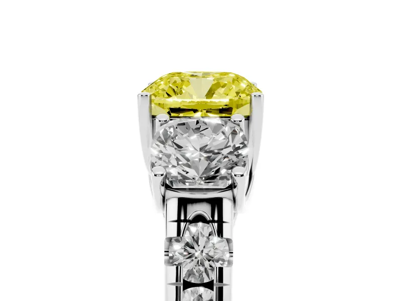 Fancy Yellow Cushion Cut Diamond Three-Stone Ring Set in Platinum with Pavé Band
