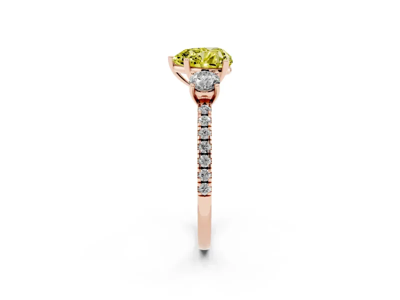 Fancy Yellow Heart Cut Diamond Three-Stone Ring Set in Rose gold with Pavé Band and Graduated Sides