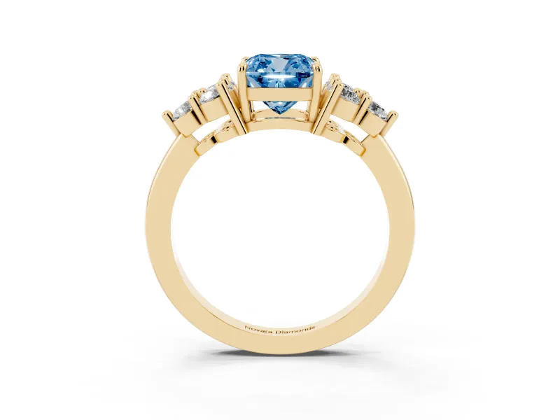 Fancy Blue Cushion Cut Diamond Solitaire Ring Set in Yellow gold with Cluster Accents on Each Side