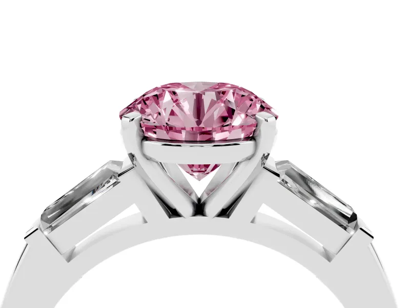 Fancy Pink Round Cut Diamond Solitaire Ring Set in Platinum with Tapered Baguette Side Stones and Prong Setting
