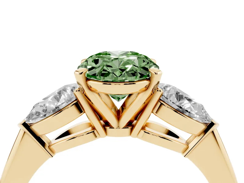 Fancy Green Three-Stone Oval Cut Diamond Ring Set in Yellow gold with Pear Side Stones and Prong Setting