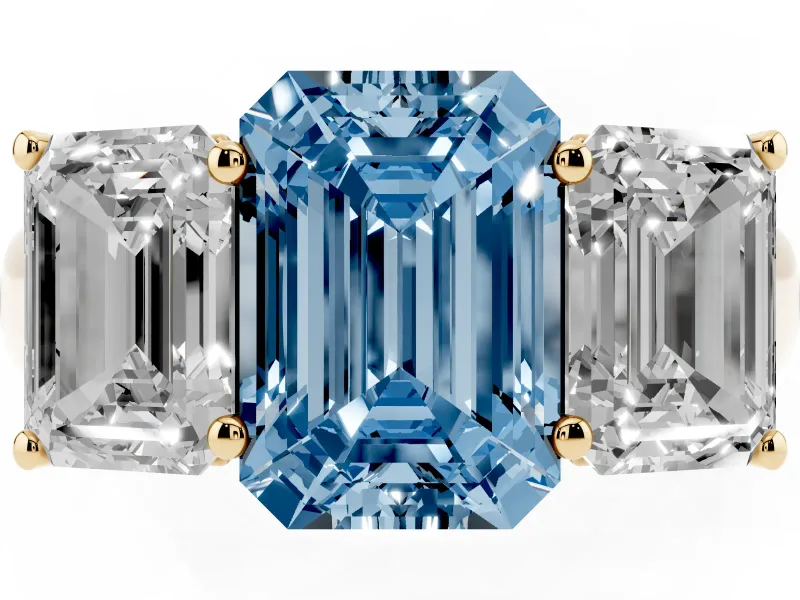 Emerald Cut Three Stone Engagement Ring Setting for a Fancy Blue Lab-Grown Diamond | Basket Prong Heads | Yellow Gold