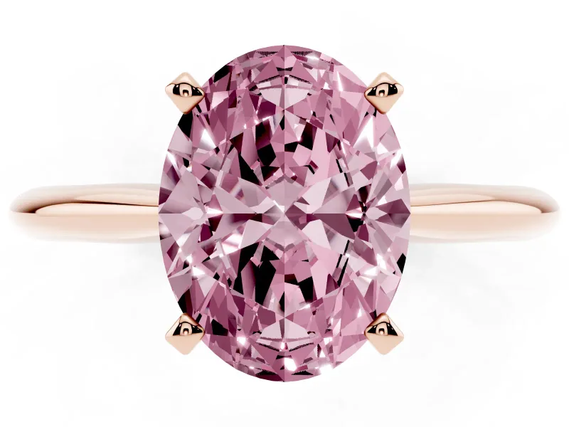 Fancy Pink Oval Cut Diamond Solitaire Ring Set in Rose gold with Prong Setting on a Plain Round Band