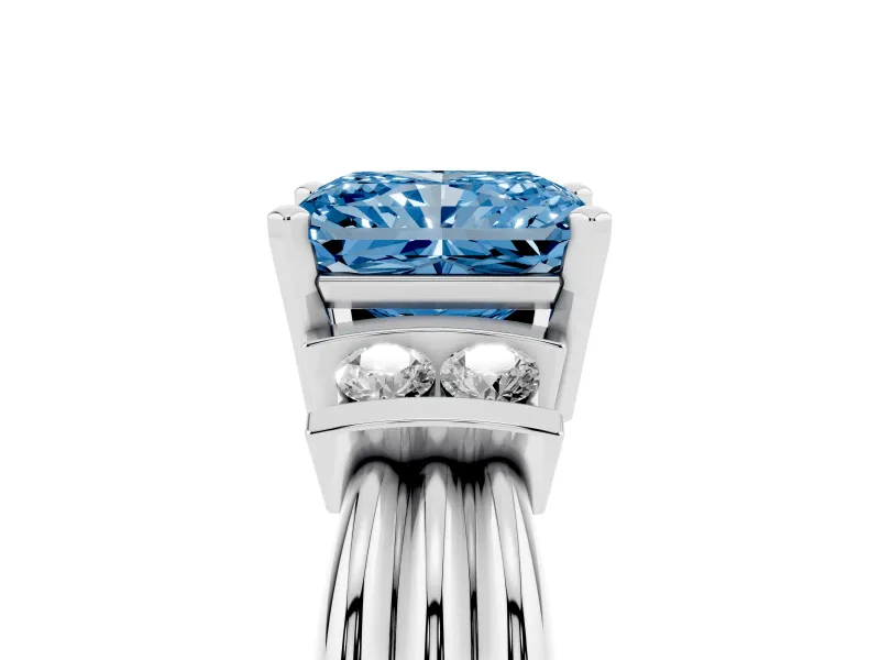Fancy Blue Three-Stone Radiant Cut Diamond Channel Set Ring Set in White gold with Bar Prongs