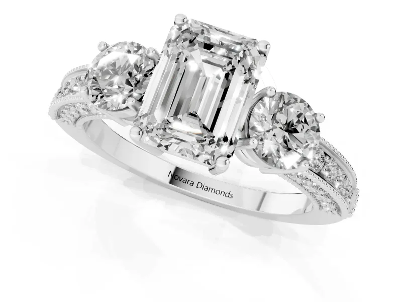Emerald Cut Diamond Three-Stone Ring Set in Platinum with Round Side Stones and Pavé Band