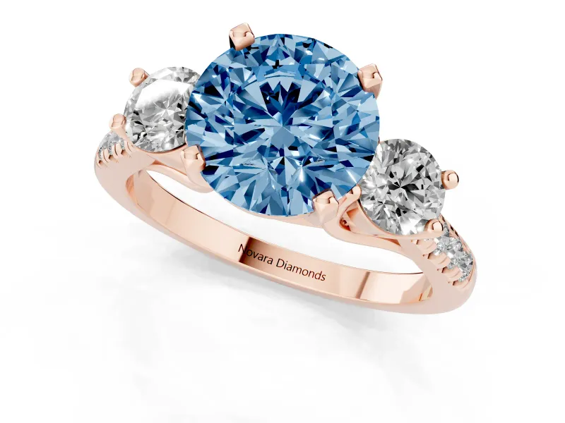 Fancy Blue Three-Stone Round Cut Diamond Pavé Band Ring Set in Rose gold with Prong-Set Trio