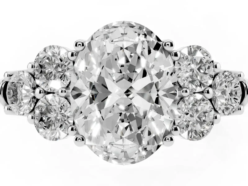 Oval Cut Diamond Cluster Ring Set in Platinum with Round Accent Stones and Prong Setting on a Plain Band