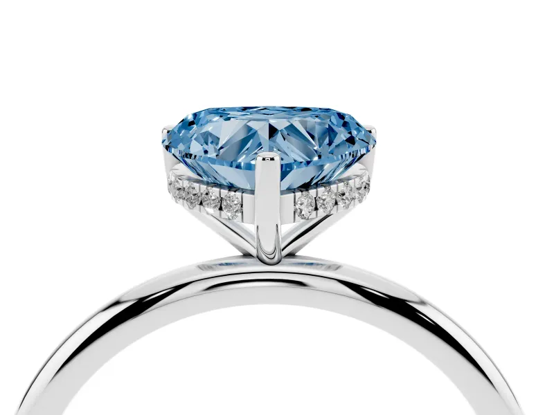 Fancy Blue Heart Cut Diamond Solitaire Engagement Ring Set in White gold with Prong Setting and Polished Band