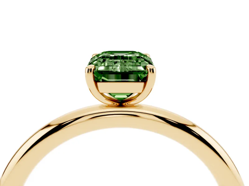 Fancy Green Emerald Cut Diamond Solitaire Ring Set in Yellow gold with Prong Setting on a Polished Plain Band