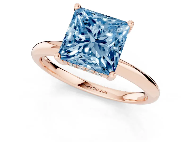 Fancy Blue Princess Cut Diamond Solitaire Engagement Ring Set in Rose gold with Prong Setting and Polished Band