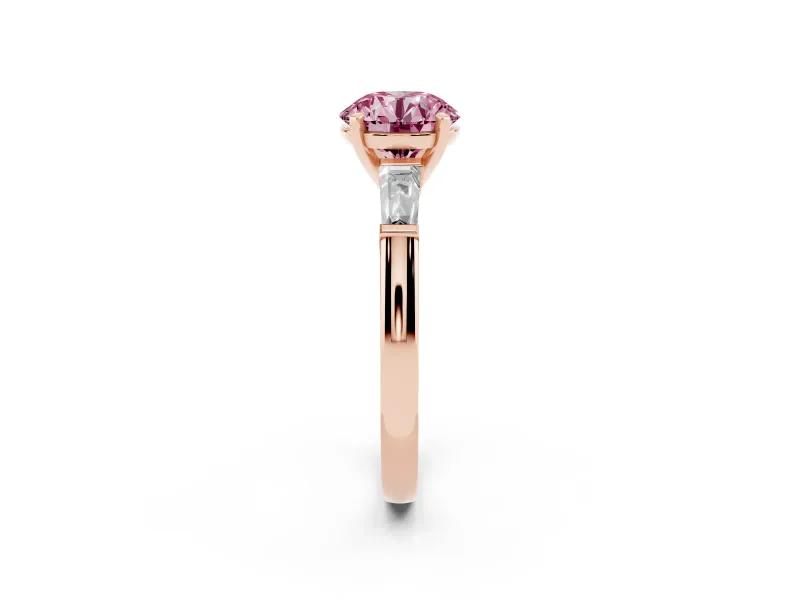 Fancy Pink Round Cut Diamond Solitaire Ring Set in Rose gold with Tapered Baguette Side Stones and Prong Setting