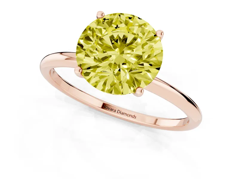 Fancy Yellow Round Cut Diamond Solitaire Engagement Ring Set in Rose gold with Thin Band and Prong Setting