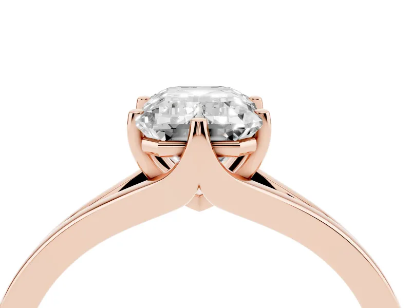 Emerald Cut Diamond Solitaire Ring Set in Rose gold with Polished Tapered Band and Prong Setting