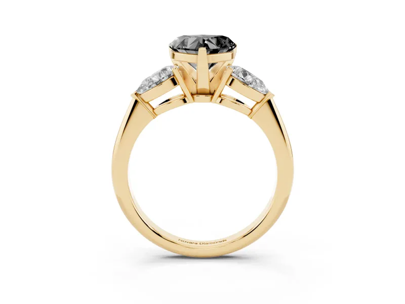 Fancy Black Three-Stone Heart Cut Diamond Ring Set in Yellow gold with Pear Side Stones and Prong Setting