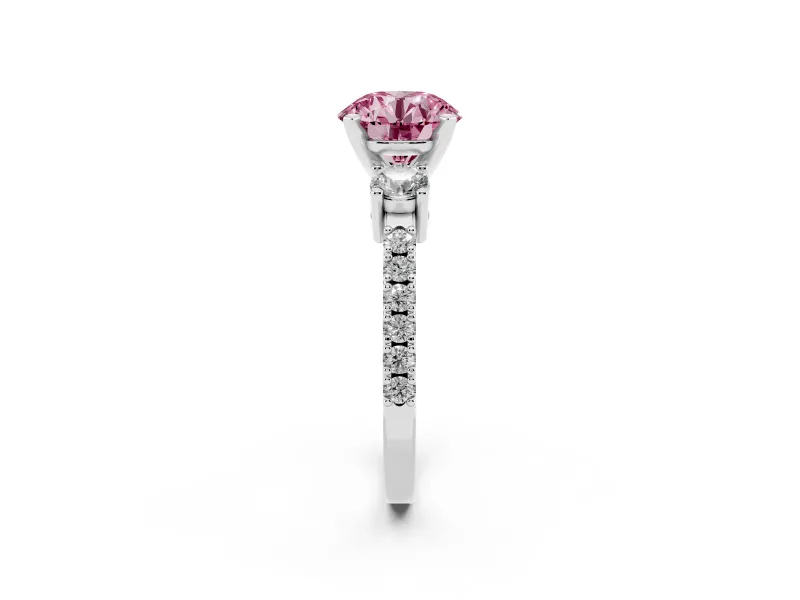 Fancy Pink Three-Stone Round Cut Diamond Pavé Band Ring Set in Platinum with Prong Setting