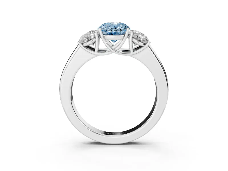 Fancy Blue Three-Stone Oval Cut Diamond Ring Set in Silver with Matching Prong Settings and Plain Band