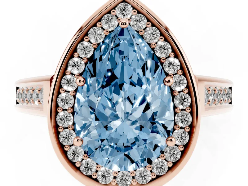 Fancy Blue Pear Cut Diamond Halo Solitaire Ring Set in Rose gold with Pavé Band and Bezel Setting