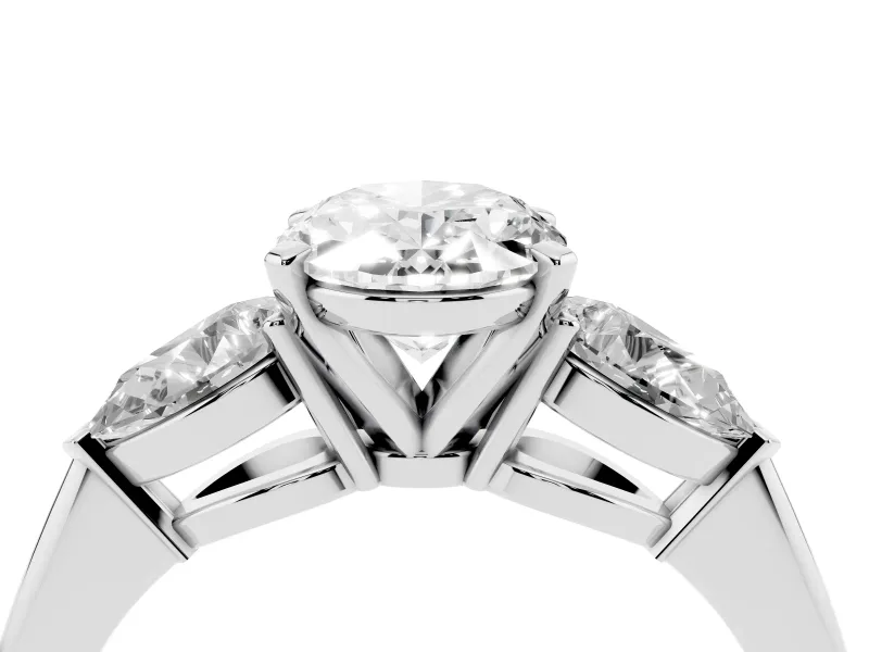 Three-Stone Oval Cut Diamond Ring Set in Platinum with Pear Side Stones and Prong Setting