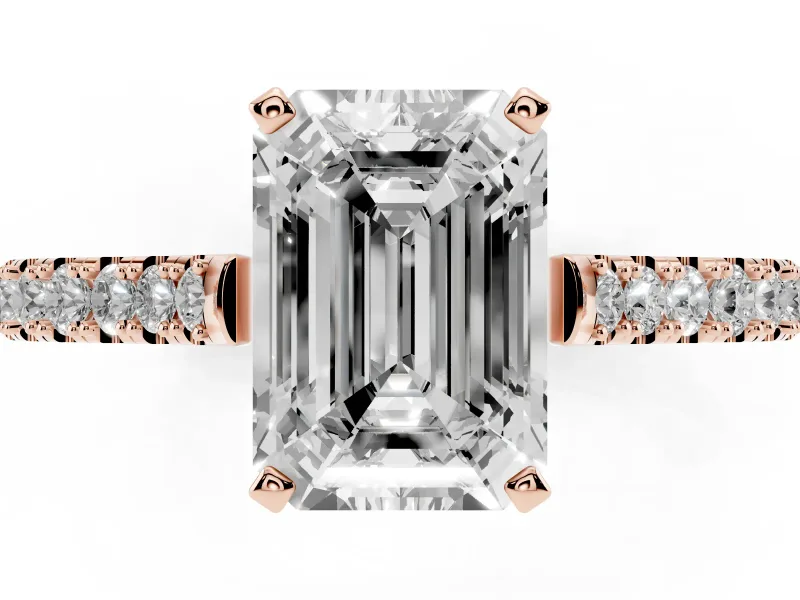 Emerald Cut Diamond Solitaire Engagement Ring Set in Rose gold with Delicate Pavé Band and Prong Setting