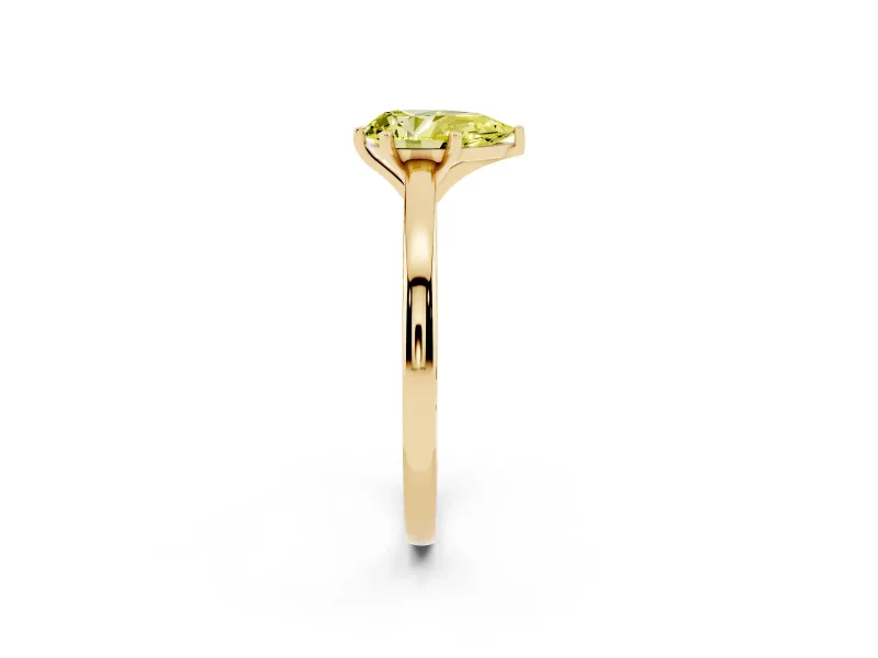 Fancy Yellow Pear Cut Diamond Solitaire Engagement Ring Set in Yellow gold with Prong Setting on a Classic Band