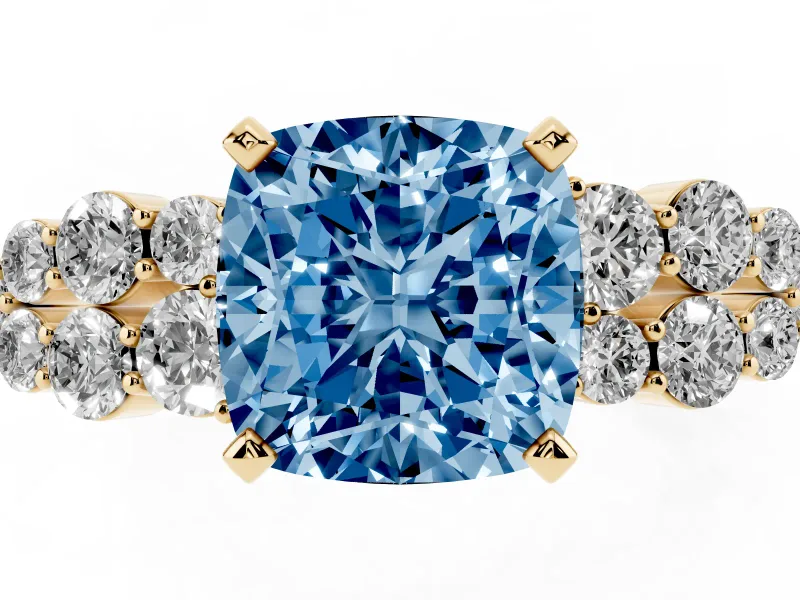 Fancy Blue Cushion Cut Diamond Cluster Engagement Ring Set in Yellow gold with Pavé Band and Prong Setting