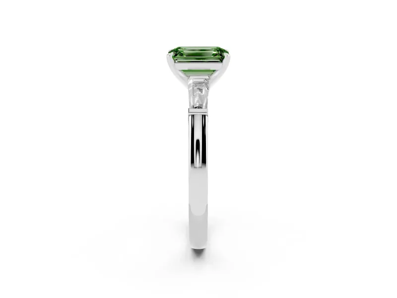 Fancy Green Emerald Cut Diamond Solitaire Ring Set in Platinum with Tapered Baguette Side Stones and Prong Setting