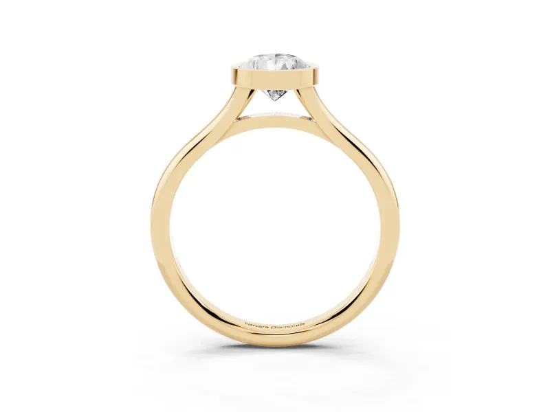 Bezel Set Pear Cut Diamond Solitaire Ring Set in Yellow gold with Tapered Band