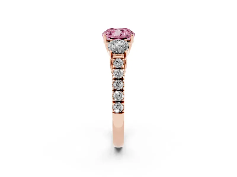 Fancy Pink Cushion Cut Diamond Three-Stone Ring Set in Rose gold with Round Side Stones and Delicate Pavé Band