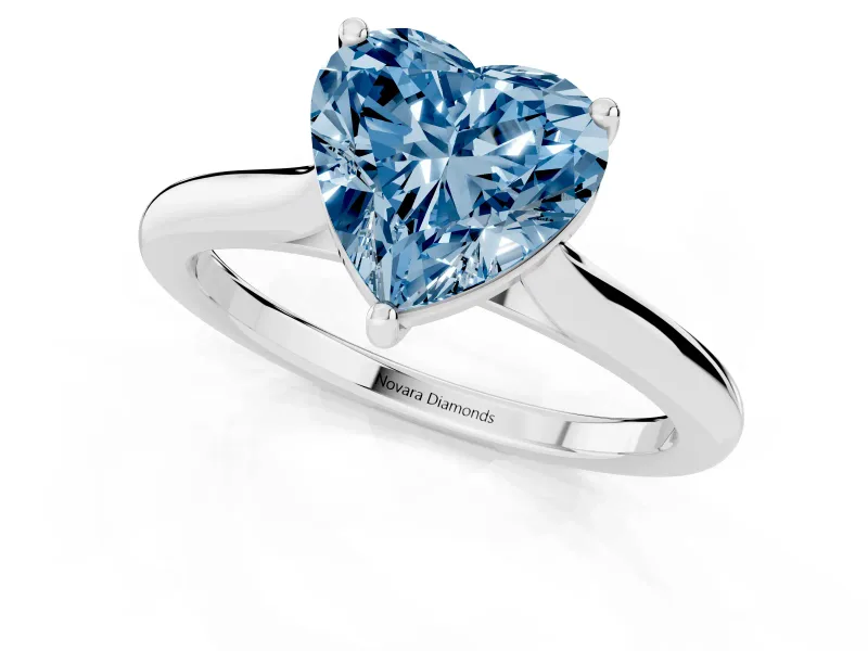 Fancy Blue Heart Cut Diamond Solitaire Ring Set in White gold with Cathedral Band and Prong Setting