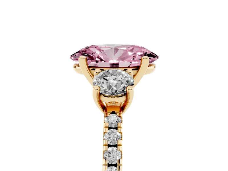 Fancy Pink Oval Cut Diamond Three-Stone Ring Set in Yellow gold with Pavé Band and Graduated Sides