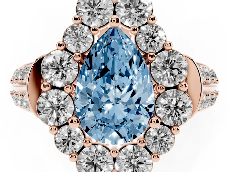 Fancy Blue Pear Cut Diamond Halo Engagement Ring Set in Rose gold with Split Shank and Prong Setting