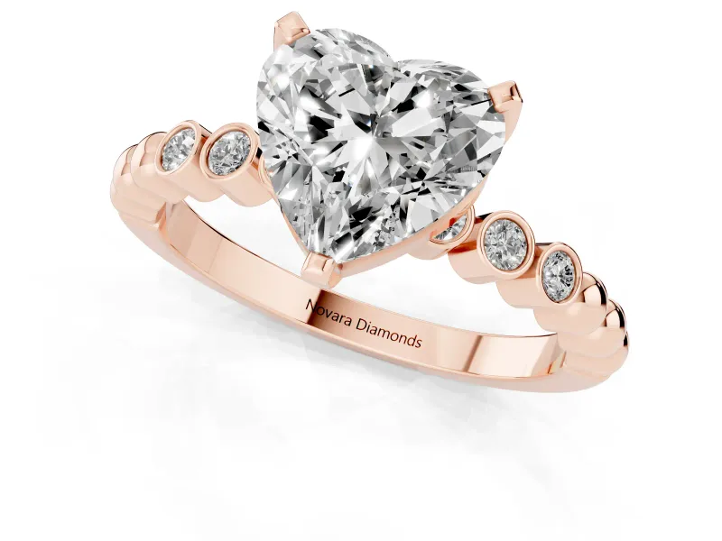 Heart Cut Diamond Solitaire Engagement Ring Set in Rose gold with Bezel Accents on Beaded Band